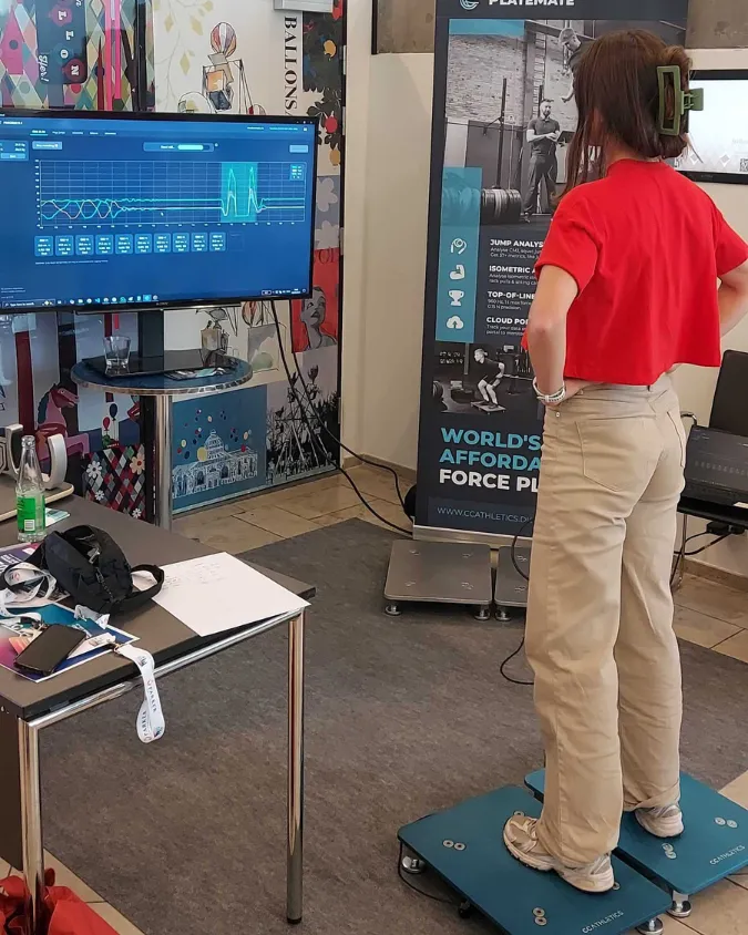 A visitor trying a force-plate demo at our booth.
